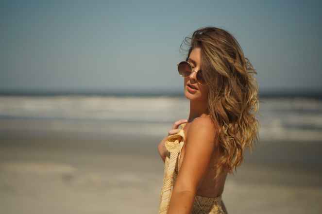 woman standing while posing